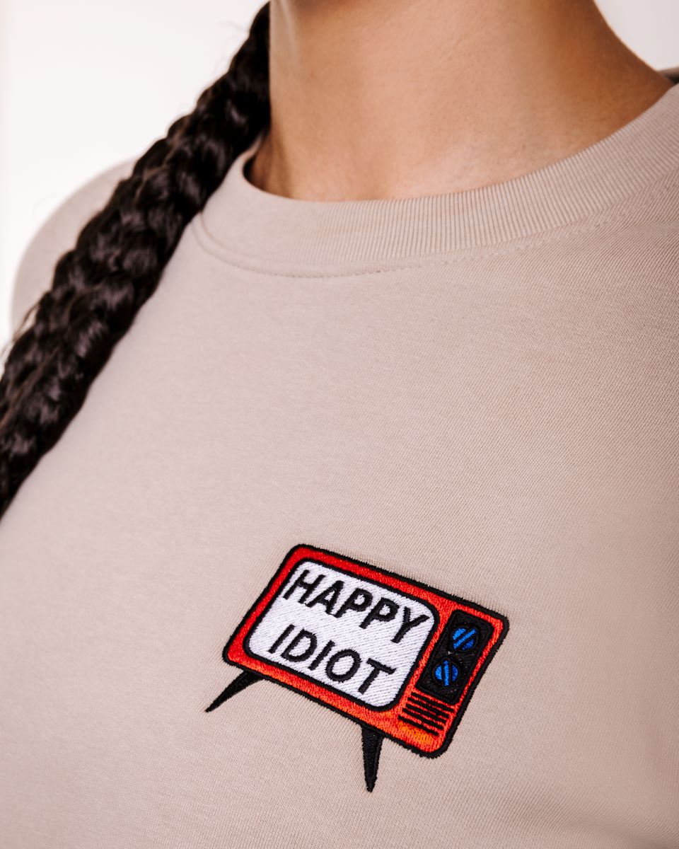 HAPPY IDIOT Tv Sweatshirt, beige, close up of design 